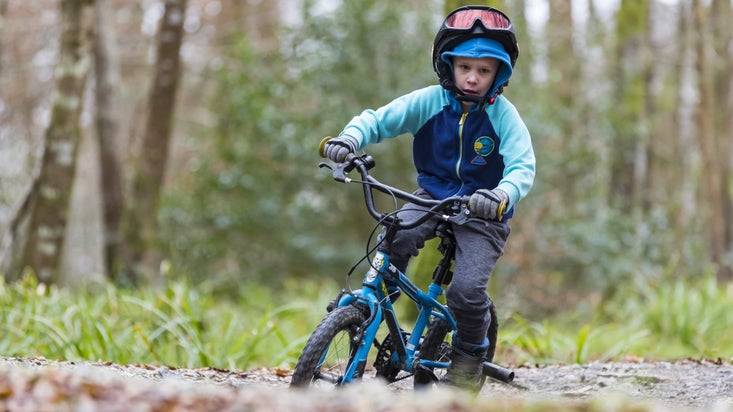 Child on the cycle trail at Lanhydrock, Cornwall